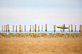 Empty sun lounges and closed parasols on the beach Royalty Free Stock Photo