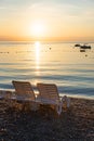 Empty sunbed chairs at gravel beach moscenicka draga croatia, sunrise scenery