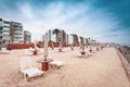 Empty sunbeds on the beach near the sea in the resort. Royalty Free Stock Photo
