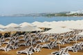 Empty sunbeds on the beach overlooking the sea