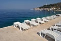 Empty sunbeds in beach of Podgora