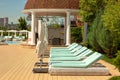 Empty sunbeds, closed umbrellas and nobody everywhere. Royalty Free Stock Photo