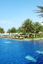 Empty sunbeds by the resort pool