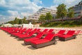 Empty sunbeds in a row on the sand beach