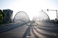 Empty sunlit city street with asphalt road on early morning in Cordoba. View to bridge called Puente del Bicentenario Royalty Free Stock Photo