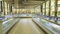 Empty supermarket aisle with shelves full of products Royalty Free Stock Photo