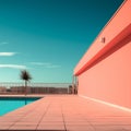 an empty swimming pool next to a pink building