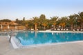 Empty swimmingpool with palmtrees