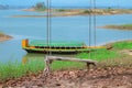 Empty swing with amazing and colorful view of beautiful boat in Kaptai Lake, Rangamati, Bangladesh.