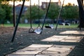 Empty Swing at a Playground at Sunset Royalty Free Stock Photo