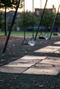 Empty Swing at a Playground at Sunset Royalty Free Stock Photo