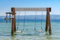 Empty swing in the sea near Omis, Croatia