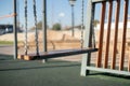 empty swing seat on the children playground as the symbol of sadness and loneliness