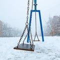 Empty swing in winter