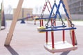 empty swings and carousels at the playground.