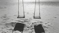 Empty Swings on a Deserted Beach Royalty Free Stock Photo