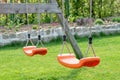 Empty swings in the garden Royalty Free Stock Photo