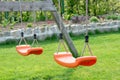 Empty swings in the garden Royalty Free Stock Photo