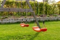 Empty swings in the garden Royalty Free Stock Photo