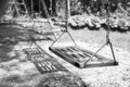 Empty swings on playground.wings in city park. Empty chain swings in summer kids children playground Royalty Free Stock Photo