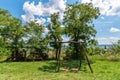 Empty swings at public park. Wooden children`s playground Royalty Free Stock Photo