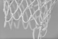 Empty Swooshing Basketball Net Close Up with gray background. Horizontal sport theme poster, greeting cards, headers, website and