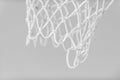 Empty Swooshing Basketball Net Close Up with gray background. Horizontal sport theme poster, greeting cards, headers, website and