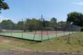 Empty synthetic outdoor green red tennis court