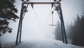 Empty t-bar lift in fog in mountains Royalty Free Stock Photo