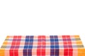 Empty table background. Empty wooden deck table covered with multicolored checkered tablecloth isolated on a white background. Royalty Free Stock Photo