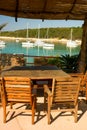 Empty table in beach restaurant on lagoon Royalty Free Stock Photo