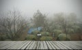 Empty Table on Blur Camping Tent in Forest with Weather Fog in Dawn Backgound Royalty Free Stock Photo