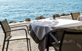 Empty table in a cafe on the shore of the sea or lake Royalty Free Stock Photo