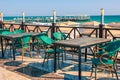 Empty table and chairs in restaurant on the beach, Turkey. Beach cafe near sea, outdoors. Travel and vacation concept Royalty Free Stock Photo