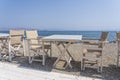 Empty table and chairs in restaurant, Greece. Beach cafe near sea, outdoors. Travel and vacation concept Royalty Free Stock Photo