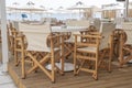 Empty table and chairs in restaurant, Greece. Beach cafe near sea, outdoors. Travel and vacation concept Royalty Free Stock Photo