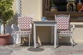 Empty table and chairs in restaurant, Greece. Beach cafe near sea, outdoors. Travel and vacation concept Royalty Free Stock Photo