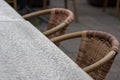 Empty table and empty chairs of summer restaurant or beer garden in summer on rainy day with raindrops and no guests, no income on