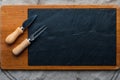 Empty table for cheeses and other openings. Copyspace Copy space Blackboard Fork and knife for cheese. Top View