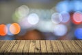 Empty table with colorful bokeh. 3D illustration. City light con