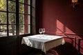 Empty table on dark red wall with window light and shadow Royalty Free Stock Photo