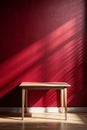 Empty Table with Dark Red Wall and Window Light Shadow Royalty Free Stock Photo