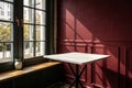 Empty table with dark red wall and window light Royalty Free Stock Photo