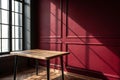 Empty table with dark red wall and window light Royalty Free Stock Photo