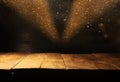 Empty table in front of black and gold glitter lights background Royalty Free Stock Photo