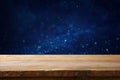 Empty table in front of blue glitter lights background Royalty Free Stock Photo