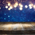 Empty table in front of blue glitter lights background Royalty Free Stock Photo