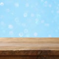 Empty table in front of blue glitter lights background Royalty Free Stock Photo