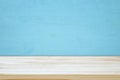 Empty table in front of blue wooden background. For product display montage Royalty Free Stock Photo