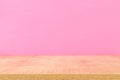 Empty table in front of pastel pink background. For product display montage. Royalty Free Stock Photo